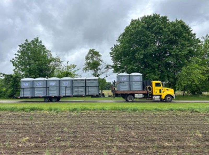 Portable toilet rentals lined up at outdoor event site in Mount Laurel, NJ