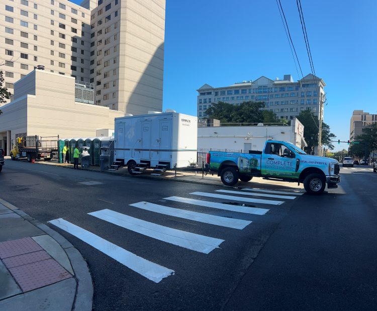Portable restroom trailer and toilets deployed on downtown event street in Glassboro, NJ